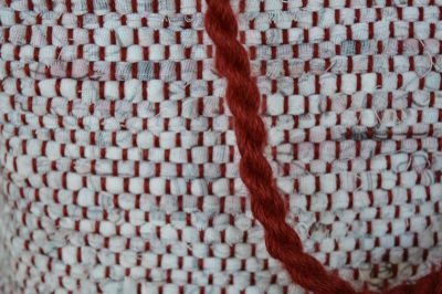 twisted cord made from the waste warp used for the handles